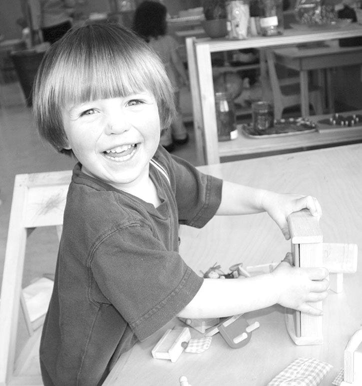 2009 — Little Badger Early Learning Centre student Nico plays with toys and learning tools during a break between snack time and heading outside.