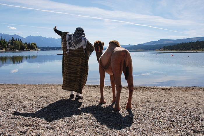 After getting a much-needed drink for his drug sniffing camel named Alice