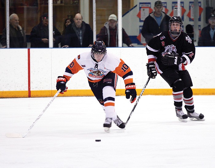 Rockies forward Ryan Henderson attempts to catch up to the puck during the Rockies home game against Fernie December 17.