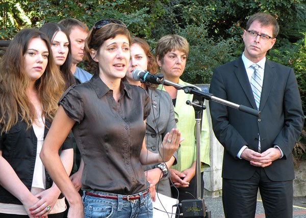 NDP leader Adrian Dix listens as Camosun College faculty association president Bronwen Welch describes financial hardships of students.