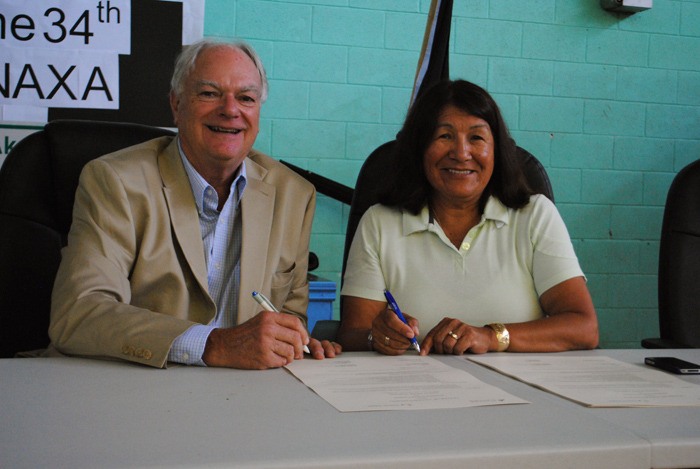 Interior Health Board Chair Norman Embree and Ktunaxa Nation Chair Kathryn Teneese re-sign a Letter of Understanding during the KNC Annual General Assembly in Creston.