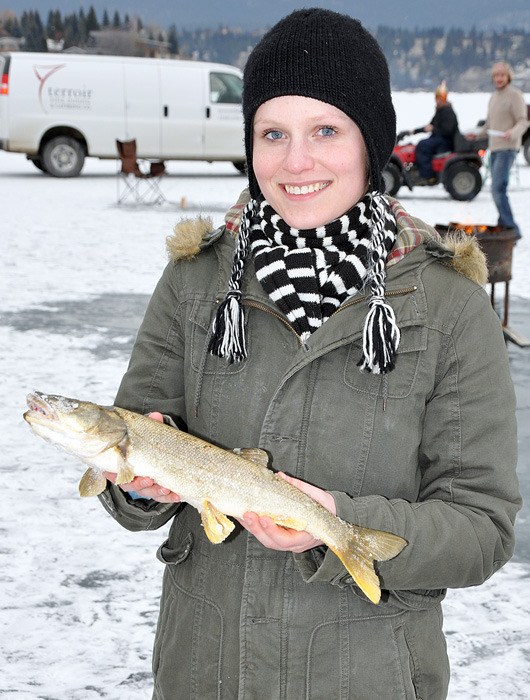 A participant in the Kinsmen Club Fishing Derby shows off one of last year's whoppers.