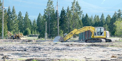 Machinery sits upon the developing land behind Abby Carpets in Invermere.