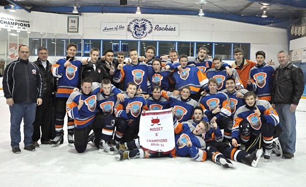 The Windermere Valley Minor Hockey Association midget boys' team celebrates a hard-fought victory against the representatives from Cranbrook in a banner tournament held at the Eddie Mountain Memorial Arena in Invermere. The team had already clinched a trip to the provincial tournament which is being held in Cranbrook in the middle of March.