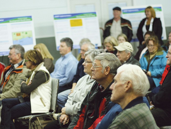 Participants look on during a presentation at the latest Lake Windermere Management Plan implementation open house in Windermere on December 29.