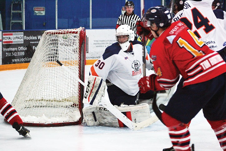 Rockies goalie Giovanni Sambrielaz stays low in front of his net while keeping an eagle eye on a Rockets’ offensive play at the Eddie Mountain Memorial Arena on February 13th. Columbia Valley won the close game against Golden 4-3.