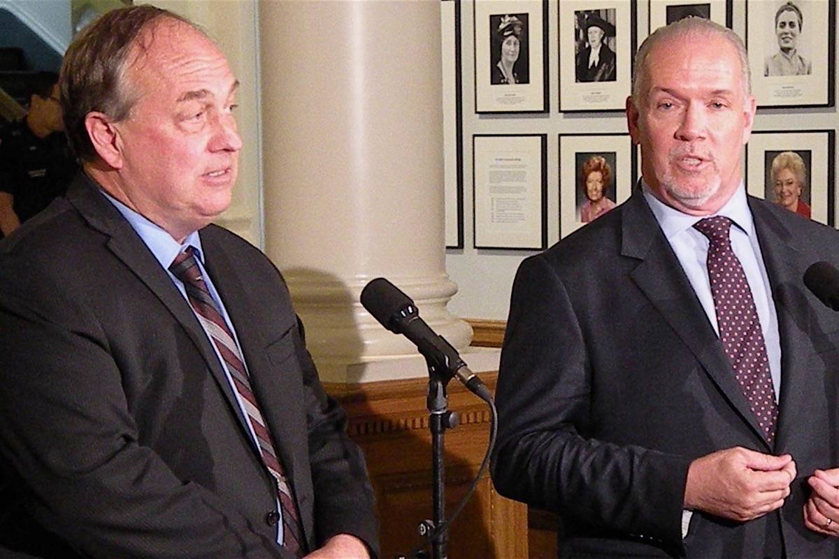 B.C. Green Party leader Andrew Weaver and NDP leader John Horgan take questions after signing their cooperation agreement for a minority government at the B.C. legislature May 30.                                Black press file photo