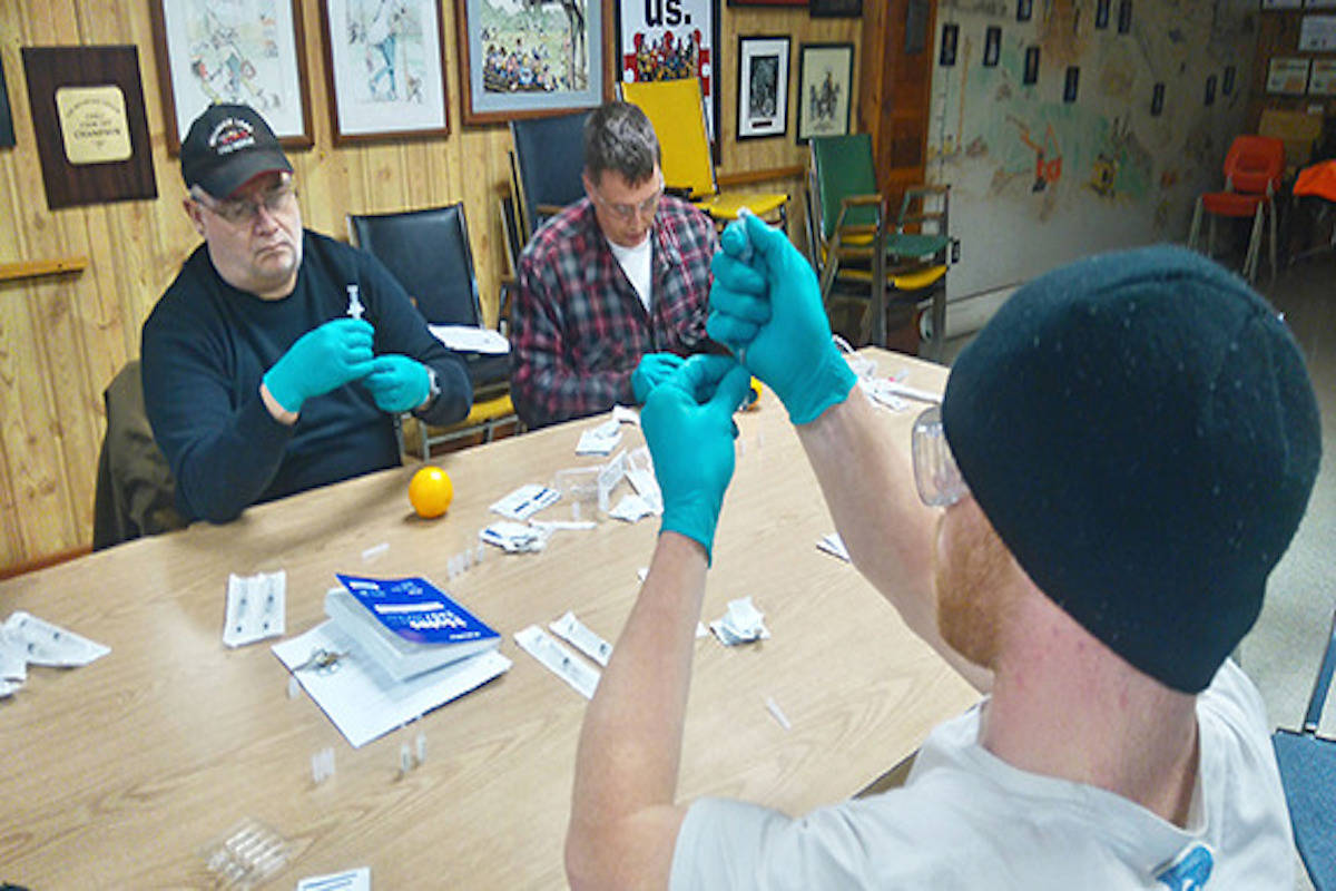 Six volunteer firefighters from the Mesachie Lake fire department learn how to administer naloxone to overdose victims.
