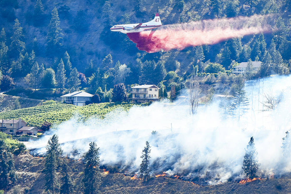 A Conair airtanker helps battle a wildifire south of Penticton last week. The Abbosford-based company currently has 26 of its planes involved in the wildfire situation across B.C. (Mark Brett/Black Press)
