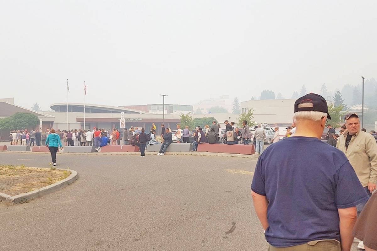 Greg Sabatino photo. Lines are long at Lake City Secondary Williams Lake Campus Tuesday morning where hundreds are waiting to register with Emergency Social Services.