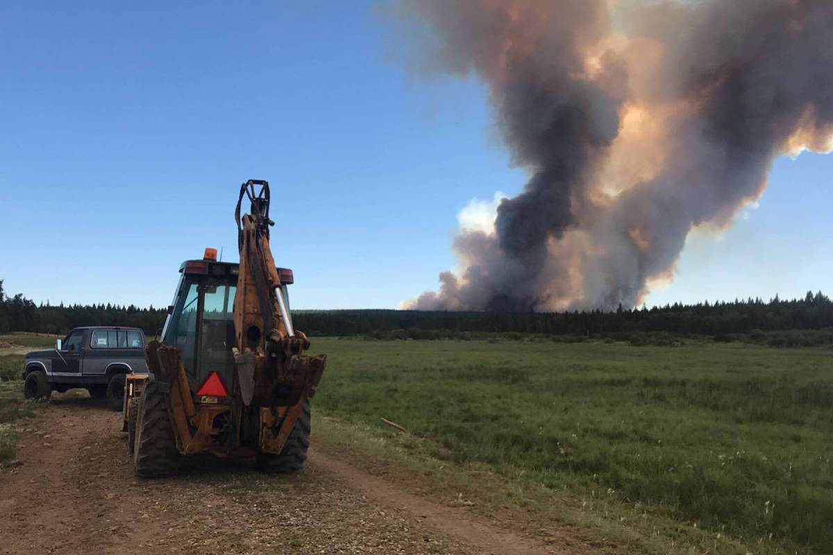 “Stubborn farmers” working behind fire lines to protect homes, animals