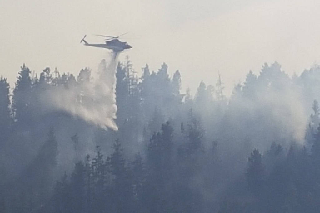 A helicopter sprays the wildfire in Princeton.                                A helicopter sprays the wildfire in Princeton. (Black Press)