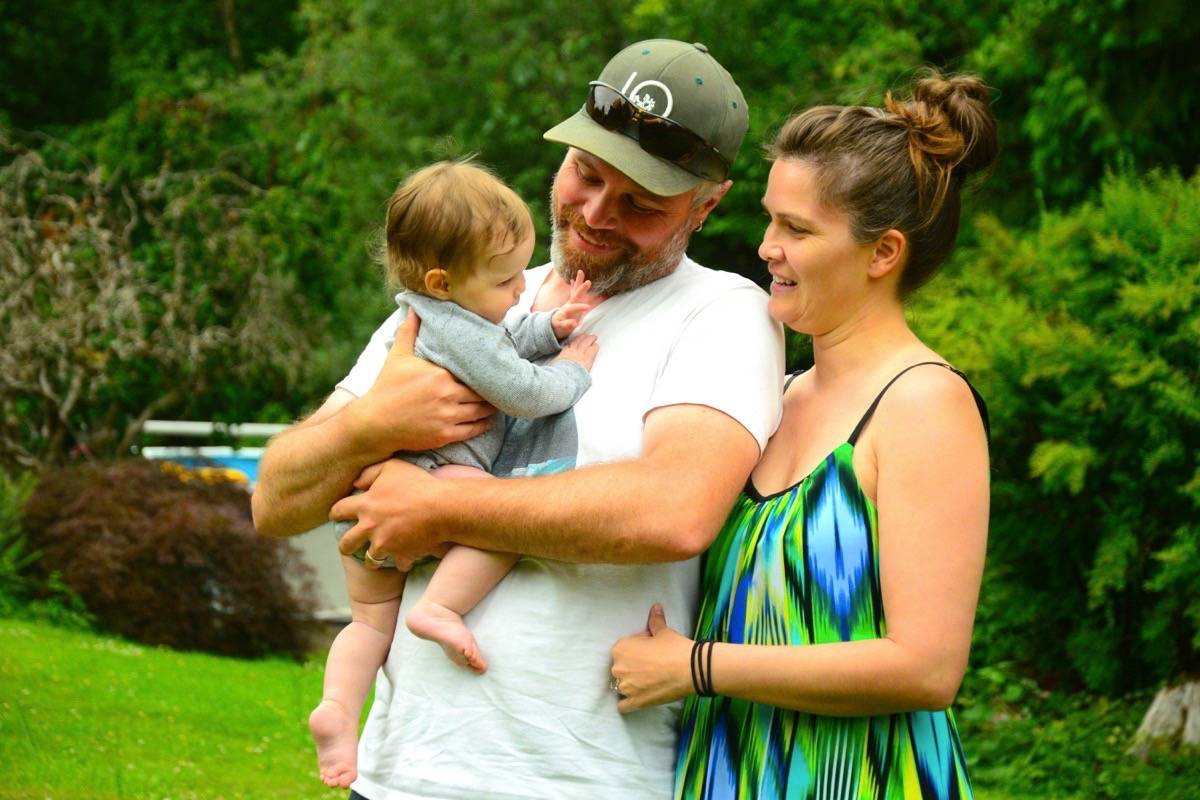 Jeremy and Darcie Welch cradle their seven-month-old son Riley at a friend’s home in Langley (KATYA SLEPIAN/BLACK PRESS)