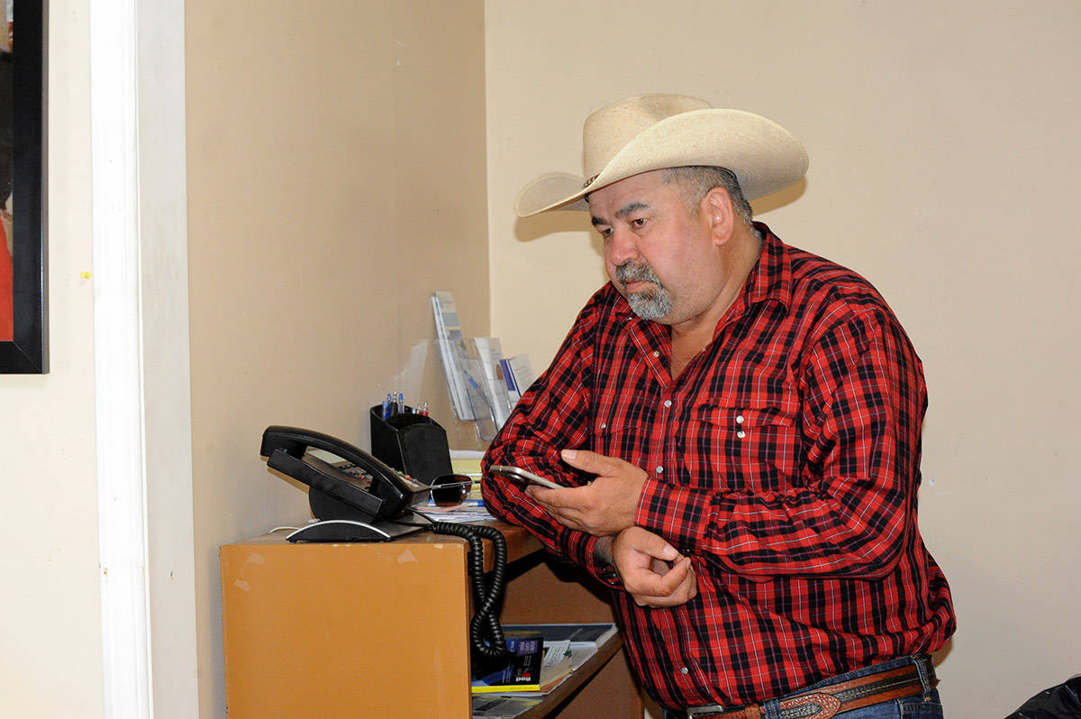 Chief Joe Alphonse working on the logistics of running a band office within an evacuated area.