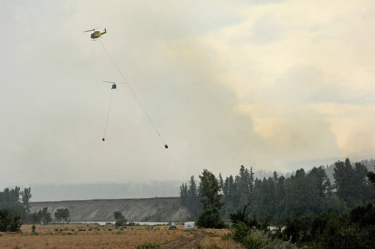 Helicopters bucket out of the nearby Chilcotin River.