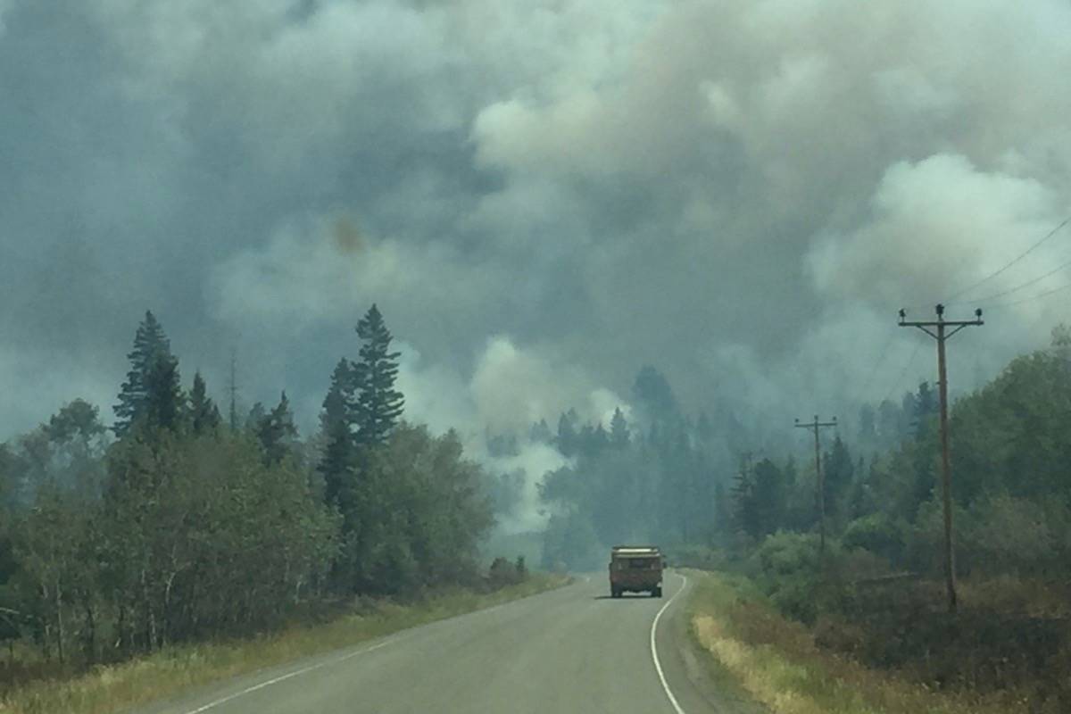 Travellers had to drive through a forest fire at Riske Creek Saturday to get back to Williams Lake, which was also surrounded by wildfires. (Angie Mindus/Williams Lake Tribune)