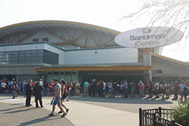 Evacuees lined up outside the Sandman Centre in Kamloops. Kimberly Vance-Lundsbye photo.