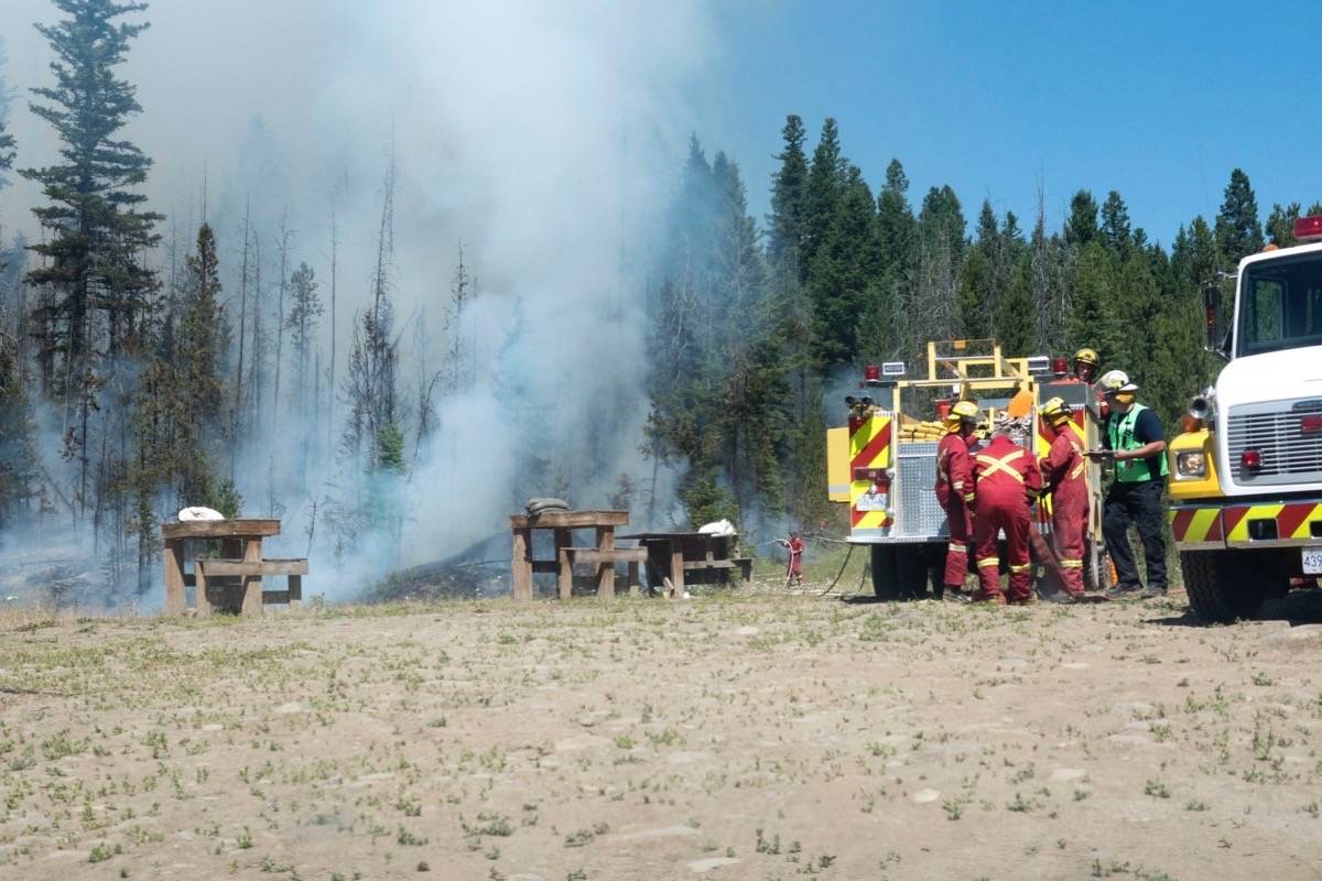 100 Mile Fire Rescue is attending a wildfire that has broken out west of town. Max Winkelman photos.