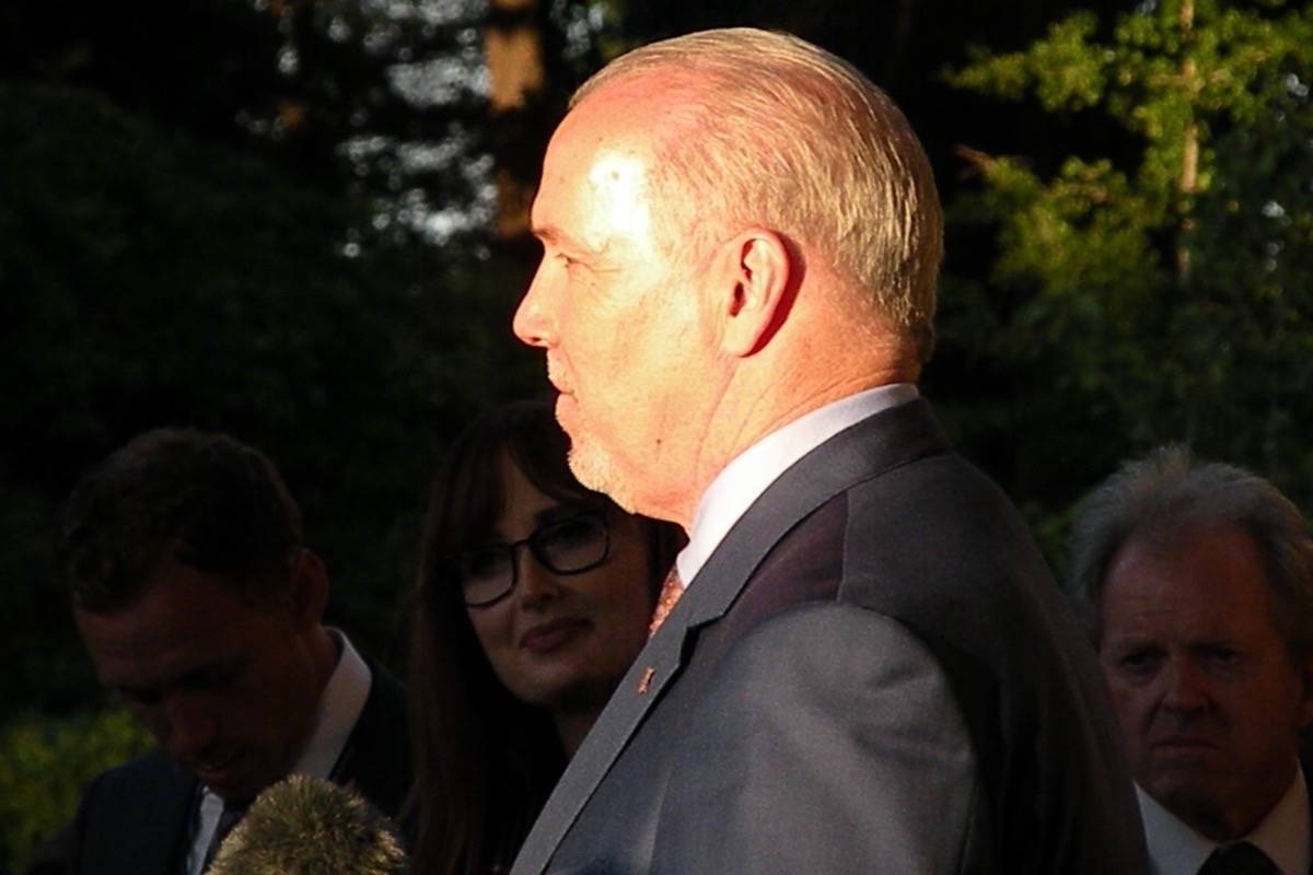 NDP leader John Horgan emerges from Government House as the sun sets June 29, moments after being named premier designate by Lt. Gov. Judith Guichon. (Tom Fletcher/Black Press)