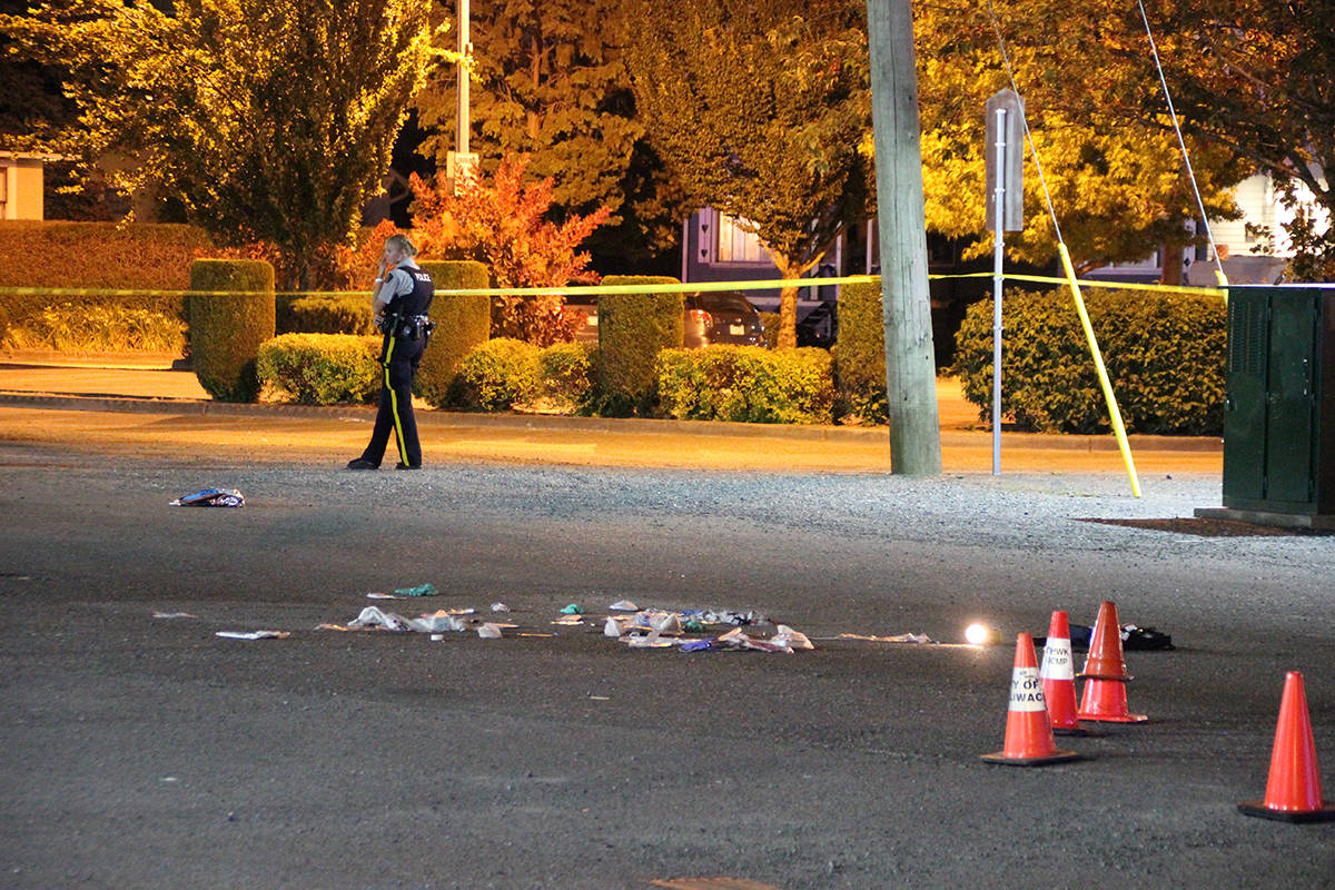 Chilliwack RCMP on scene at an Friday evening stabbing downtown that has left two people dead. (Shane MacKichan photo)