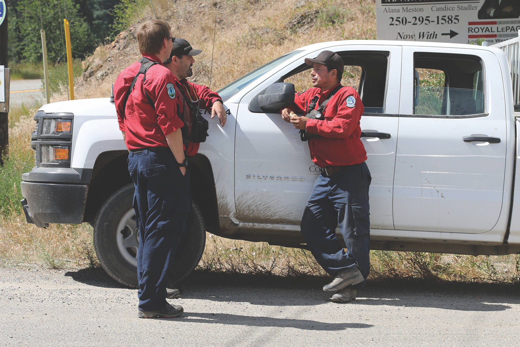 Members of the new Forestry Incident Management Team conferred earlier this afternoon at the intersection of Missuzela Lake Road.